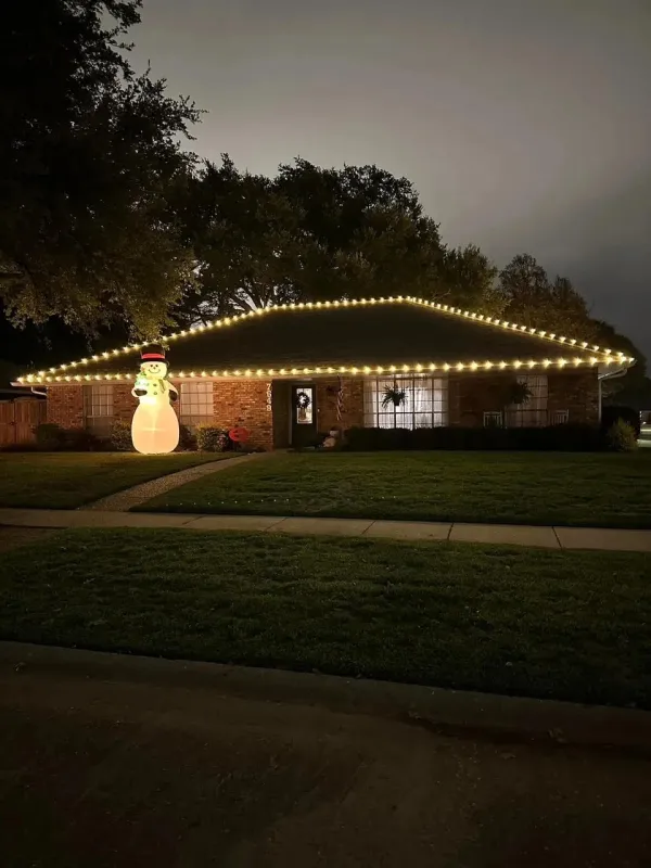 House with yellow lights on the roof